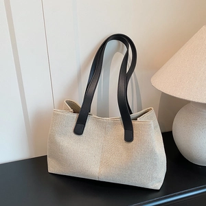 Borsa tote minimalista in tela beige con manici in pelle nera per pendolarismo e tempo libero