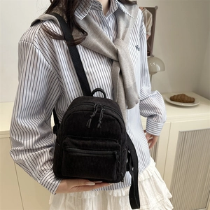 Classic black corduroy mini backpack for women featuring a vintage casual aesthetic