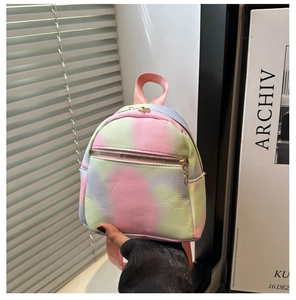 Detail of gradient mini backpack with floral metal zippers and soft textured finish