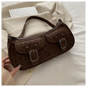 Detail of leopard print shoulder bag with two front buckled pockets and suede texture