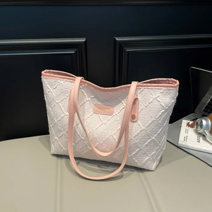 Quilted tote bag in cream and pink with large capacity and stylish texture for daily commute