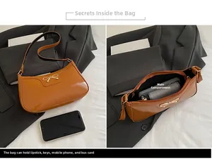 Detailed interior view of a caramel glossy hobo bag with a gold metal bow and main pocket