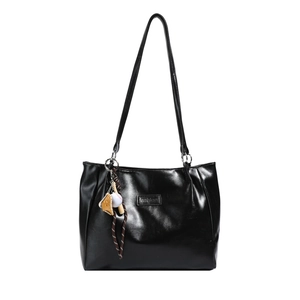 Large black glossy tote bag with silver chain straps and sporty baseball charm detail