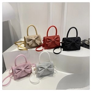 Mini borse glitterate con grandi fiocchi in oro, rosso, nero, rosa e argento