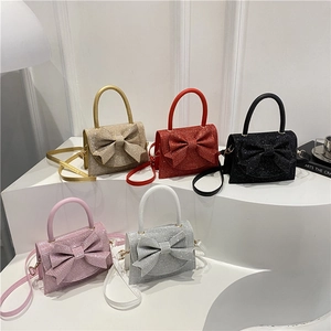 Mini borse a mano con paillettes e fiocco in oro, rosso, nero, rosa e argento per donna