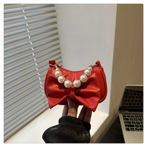 Rode mini handtas met grote strik en elegant parelhandvat voor dames