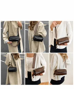 Dettagli della piccola borsa a tracolla con ampia cinghia vintage e ciondoli con perle