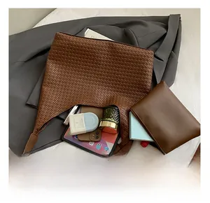 Detail view of large brown woven tote bag interior showing spacious capacity for daily items