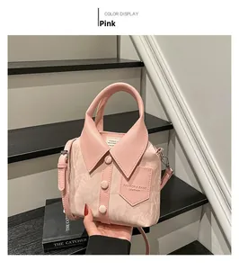 Detail of pink shirt-shaped handbag with PU leather collar, buttons and fashion logo