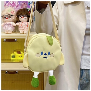 Detail of a round yellow canvas crossbody bag with cute embroidery and 3D plush legs