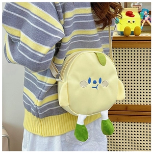 Detail of yellow round cartoon canvas crossbody bag with cute embroidery and 3D features