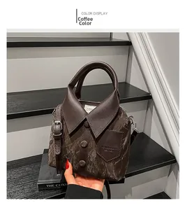 Detail view of coffee brown shirt-shaped handbag with collar and button accents