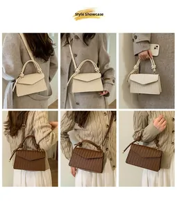 Detail of crossbody bag with woven grain texture and decorative knotted handle