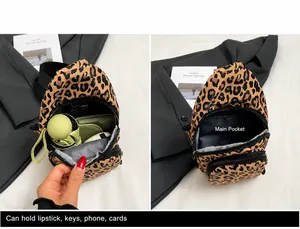 Detailed view of leopard print crossbody bag interior capacity and storage compartments