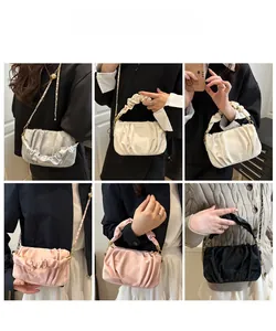 Detailed views of pleated cloud bags in four colors with chain straps and handles