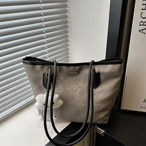 Retro grey canvas tote bag with black trim, long straps and cloud pendant for daily commute