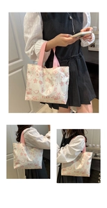 Close-up of graffiti tote bag showing pink star patterns and artistic text details