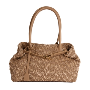 Brown bouclé tote bag with faux leather handles and gold buckle detail on white background