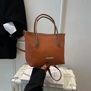 Brown lychee texture leather tote bag with silver logo for daily work commute style
