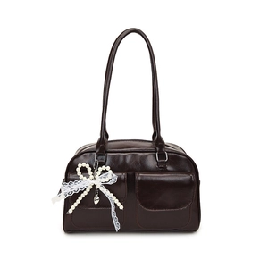 Glossy dark brown shoulder bag with bow charm and twin front pockets in vintage style