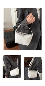 Detail of white woven checkerboard shoulder bag with silver hardware and leather strap
