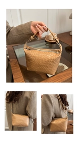 Detail of woven khaki leather tote showing crossbody strap and fine texture finish