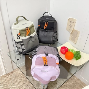Three color variants of outdoor sports backpacks in cream, black, and purple designs