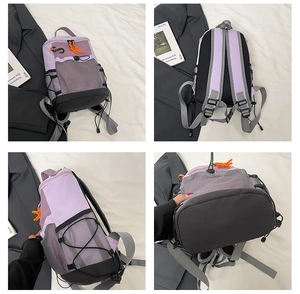 Detail view of purple outdoor backpack showing side mesh pocket and breathable mesh straps