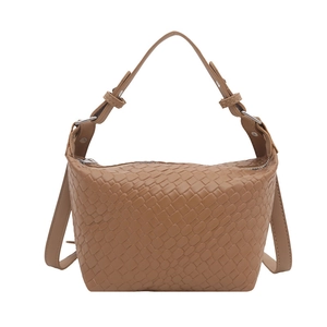 Tan woven leather handbag with silver hardware and a detachable crossbody strap