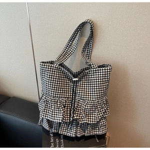 Chic black and white gingham tote bag featuring layered ruffles and drawstring closure
