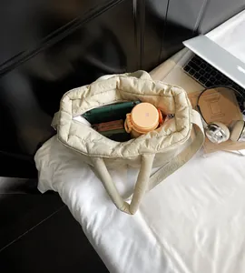 Top view of spacious beige quilted tote bag showing ample interior storage capacity