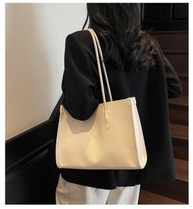 Minimalist cream leather tote bag shown on model for business and casual daily wear