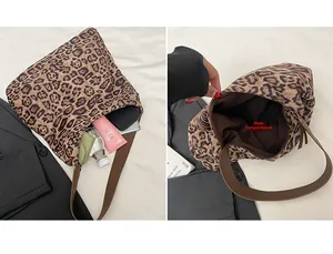 Detail view of large leopard print tote bag with spacious interior and brown strap