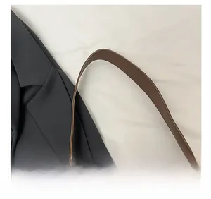 Close-up of leopard print tote bag featuring a comfortable dark brown shoulder strap
