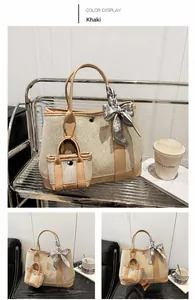 Detail of khaki canvas tote with leather trim, mini pouch and decorative silk scarf
