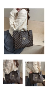 Detail of monogram tote bag with gold M logo and chain-link shoulder strap