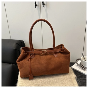 Brown faux suede oversized tote bag with long handles and decorative leather strap