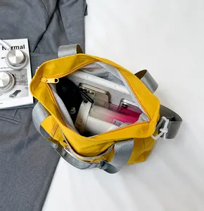 Interior view showing the spacious storage capacity of this yellow nylon tote bag