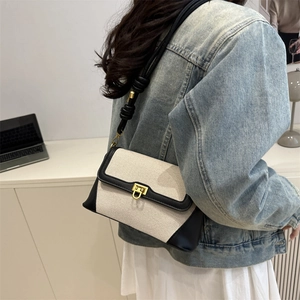 French retro canvas underarm bag with black leather trim and vintage gold lock closure