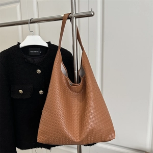 Brown large capacity woven tote bag with wide shoulder strap in premium aesthetic style