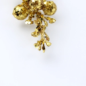 Sparkling gold glitter berry branch for Christmas wreaths and holiday garland decorations