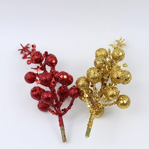 Red and gold glittery Christmas berry stems for festive wreath and garland decoration