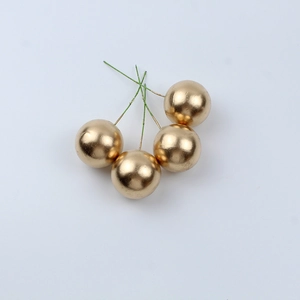 Set of four shiny gold artificial berry stems for Christmas DIY floral arrangements