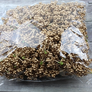 Bulk pack of golden artificial foam berries on stems for Christmas tree and wreath decor