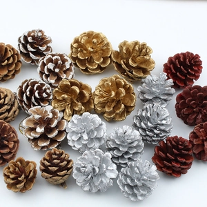 Assorted Christmas pine cones in gold, silver and red finishes for holiday decoration