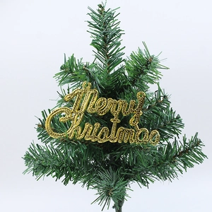 Detail of golden Merry Christmas decorative sign with embossed texture on pine branch