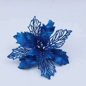 Macro detail of blue glittered artificial flower with intricate hollow-out petal design