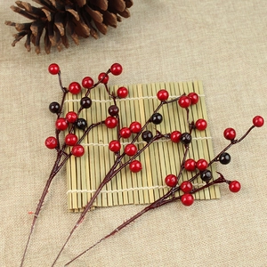 Artificial red berry branches set for Christmas tree decoration and home floral arrangements