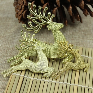 Three golden textured reindeer Christmas tree ornaments in various sizes for holiday decor