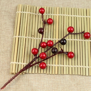 Artificial red and dark purple berry branches for Christmas tree and home decor